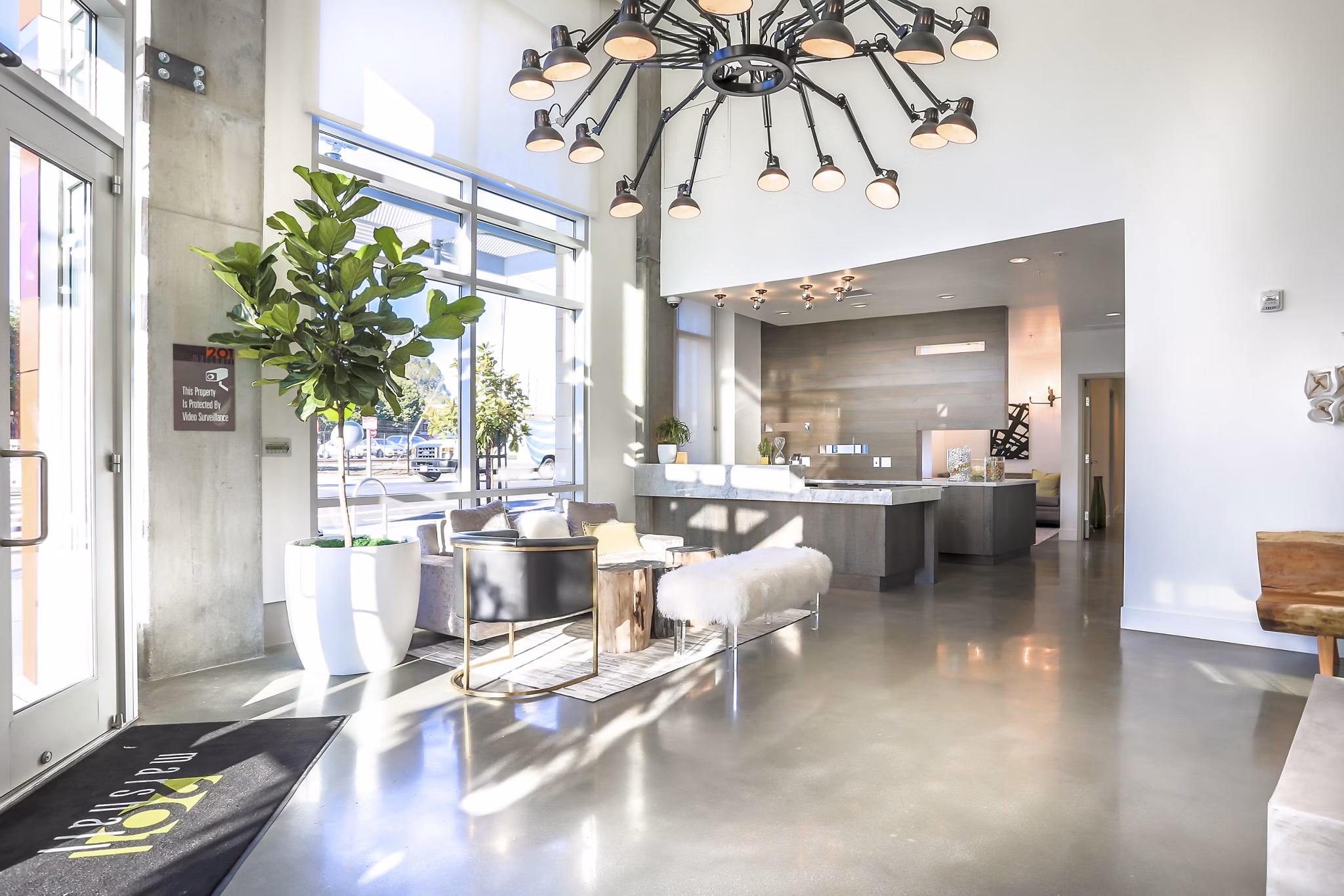 Contemporary clubhouse at 201 Marshall Apartments featuring stylish seating and a stunning fireplace