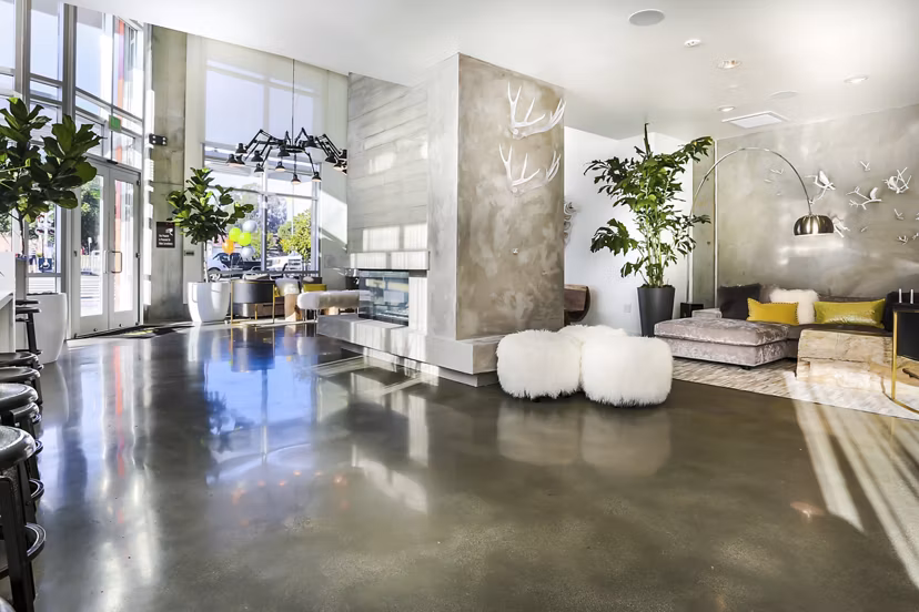 Stylish clubhouse with modern decor at 201 Marshall Apartments, ideal for social gatherings and events in vibrant urban setting