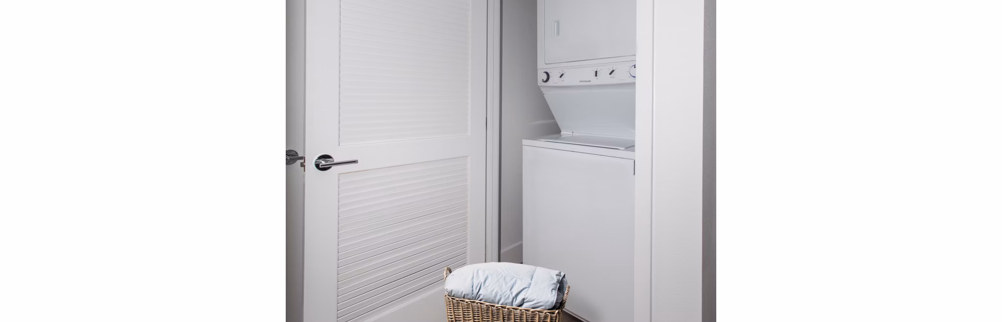 Laundry room with modern appliances at 201 Marshall Apartments, offering convenience in luxury living