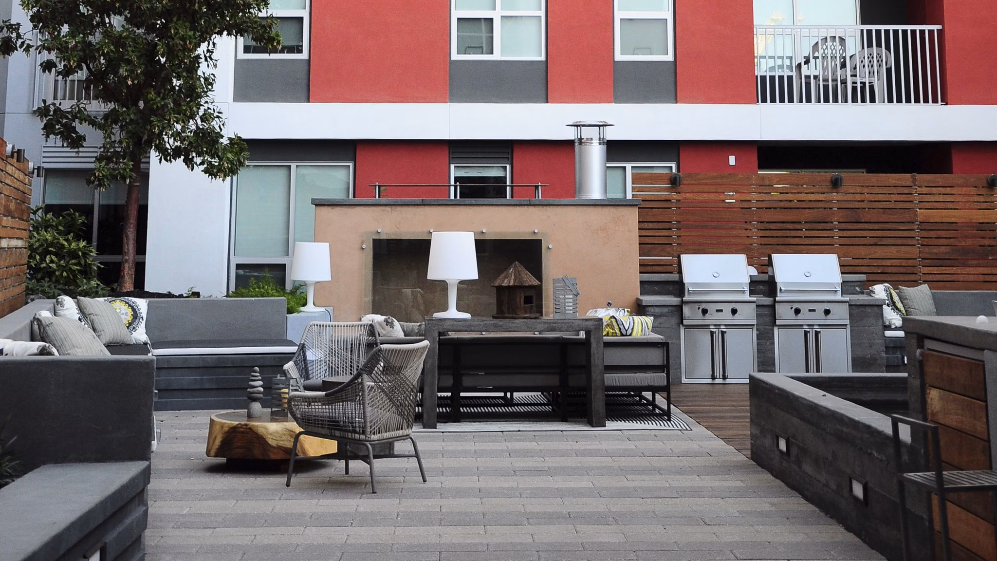 Outdoor grill area with seating at 201 Marshall Apartments, perfect for social gatherings and cookouts