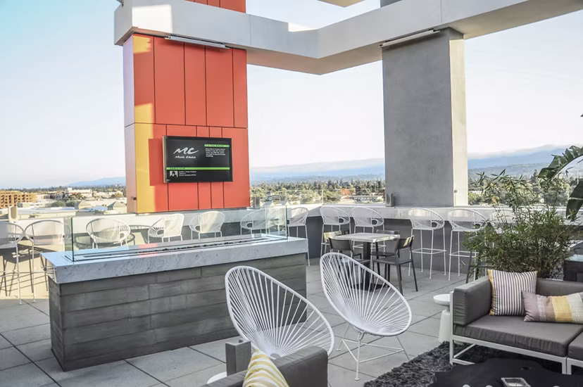 Cozy fire pit area at 201 Marshall Apartments, luxury living in the heart of downtown, offering a perfect spot for relaxation and social gatherings