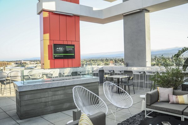 Cozy fire pit area at 201 Marshall Apartments, luxury living in the heart of downtown, offering a perfect spot for relaxation and social gatherings