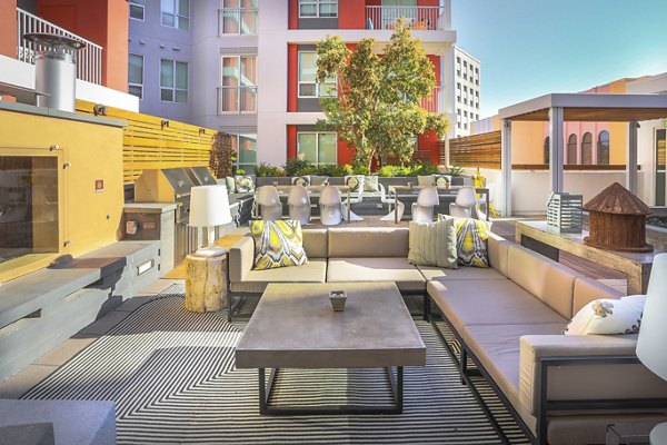 Courtyard with lush landscaping at 201 Marshall Apartments in Redwood City, offering serene outdoor seating and vibrant garden spaces