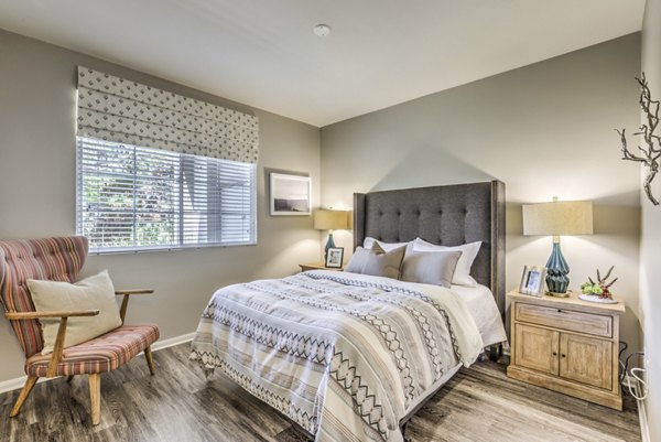 Spacious bedroom with modern decor at Signature Point Apartments, luxury living with comfort