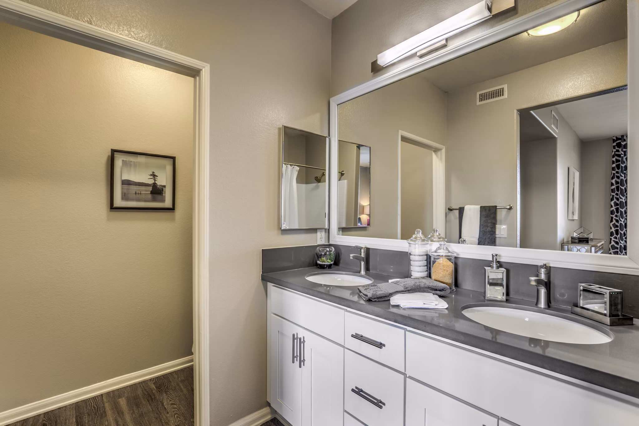 Signature Point Apartments: Modern bathroom with sleek fixtures and elegant tiling