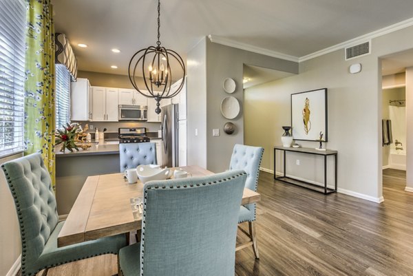 Dining area with modern furnishings and natural light at Signature Point Apartments