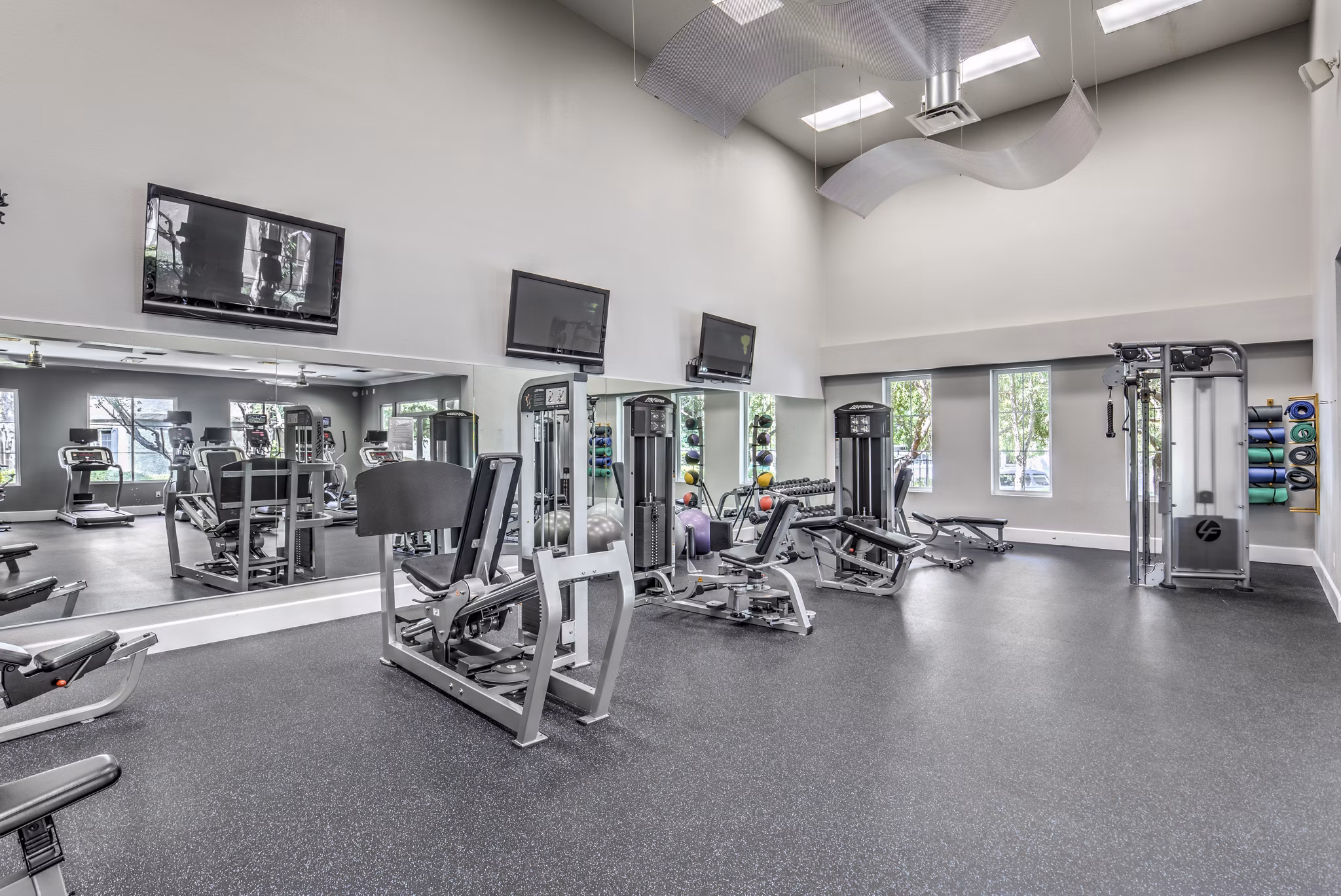 State-of-the-art fitness center with modern equipment at Signature Point Apartments, ideal for active living and wellness enthusiasts
