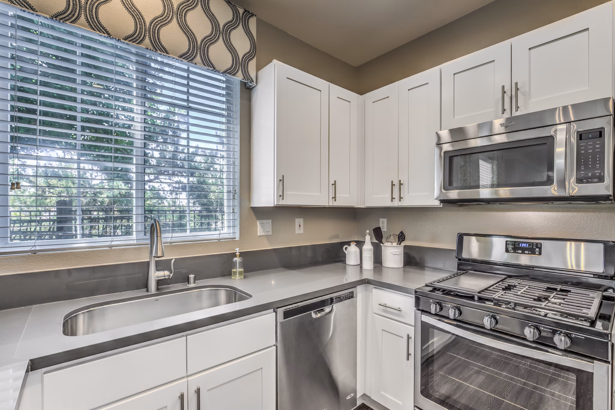 Spacious kitchen with modern appliances at Signature Point Apartments, offering luxury living spaces for residents