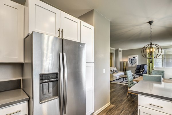 Modern kitchen with stainless steel appliances at Signature Point Apartments