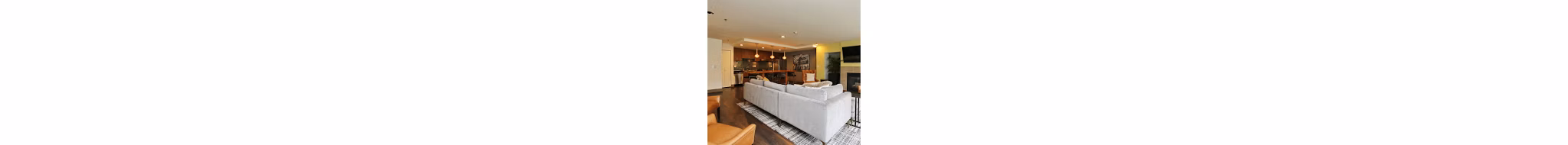 Clubhouse featuring modern design and stylish seating in Axis Apartments with luxury amenities in a vibrant community