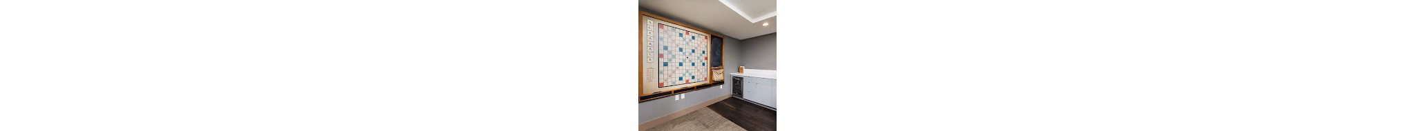 Game room featuring pool tables and arcade games at Axis Apartments Enjoy luxury amenities designed for entertainment and relaxation