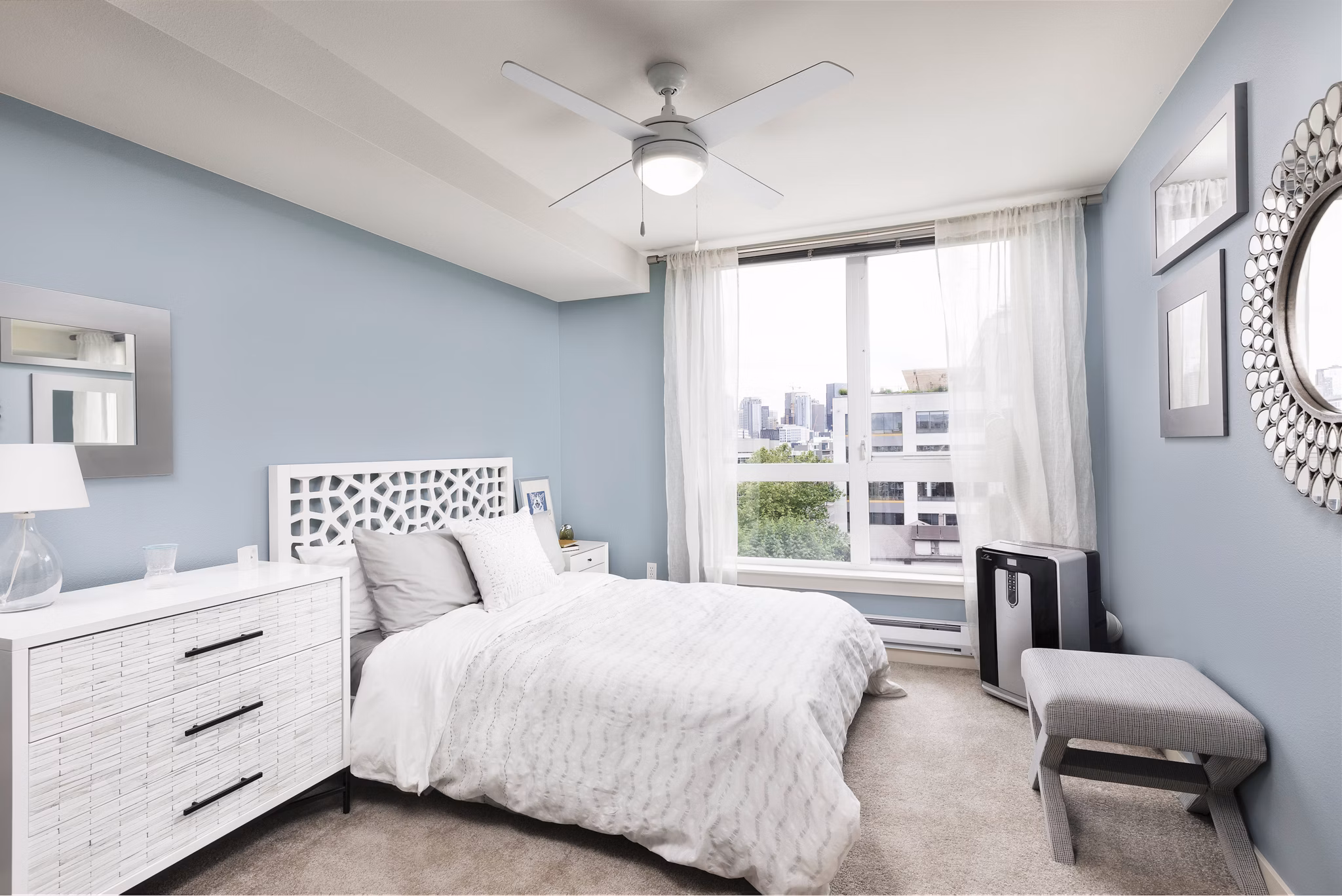Cozy bedroom with modern furnishings at Dexter Lake Union Apartments
