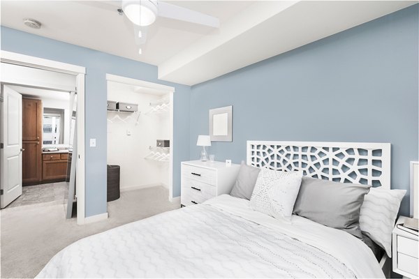 Bedroom featuring contemporary furnishings and natural light at Dexter Lake Union Apartments