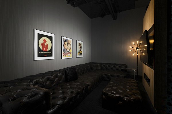 Screening room with plush seating at Dexter Lake Union Apartments for entertaining