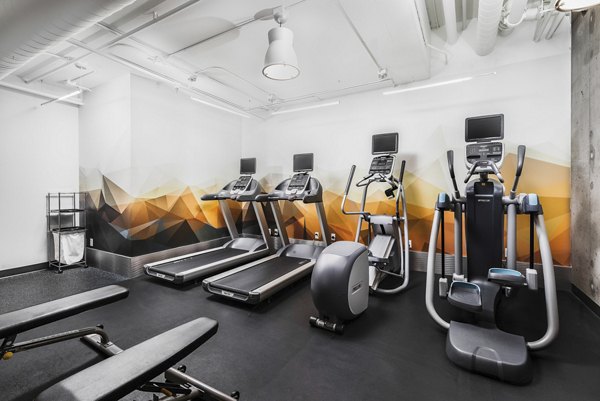 Fitness center with state-of-the-art equipment at Dexter Lake Union Apartments, offering high-end amenities for a luxury lifestyle