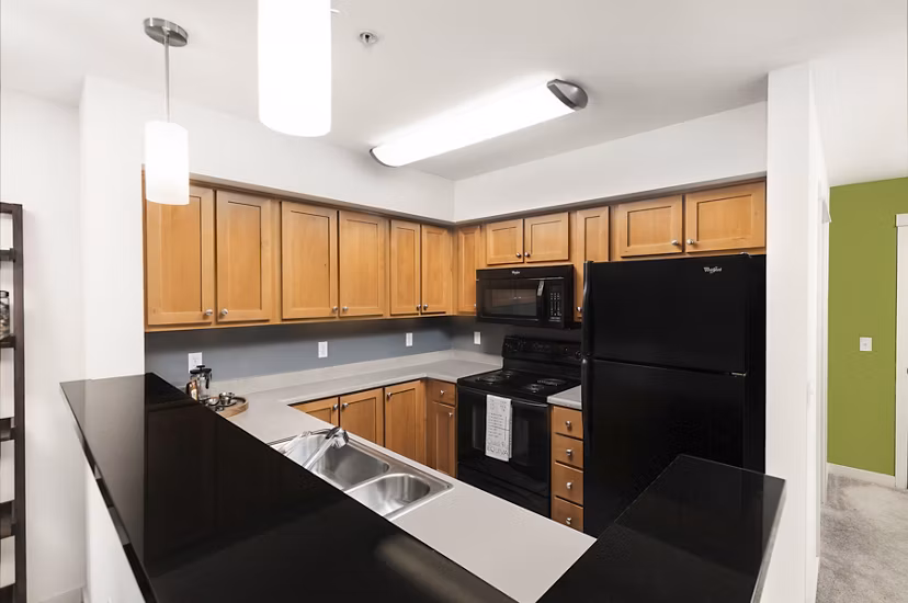 Modern kitchen with stainless steel appliances at Dexter Lake Union Apartments