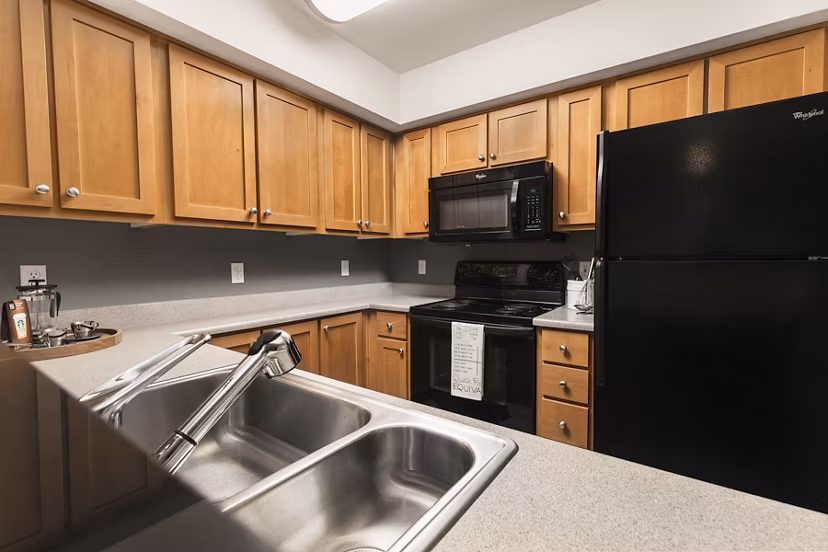 Modern kitchen with stainless steel appliances at Dexter Lake Union Apartments
