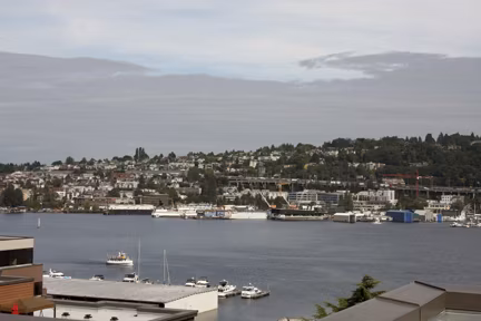 Dexter Lake Union Apartments: Scenic waterfront view of luxury apartments in vibrant Seattle neighborhood