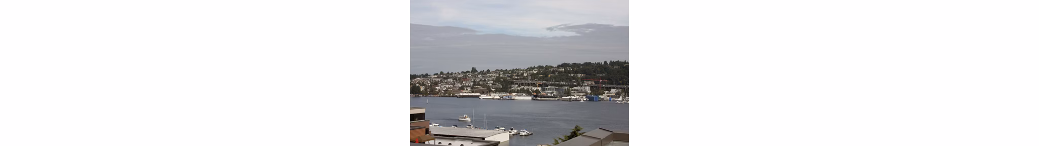 Dexter Lake Union Apartments: Scenic waterfront view of luxury apartments in vibrant Seattle neighborhood