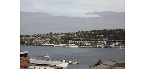 Dexter Lake Union Apartments: Scenic waterfront view of luxury apartments in vibrant Seattle neighborhood