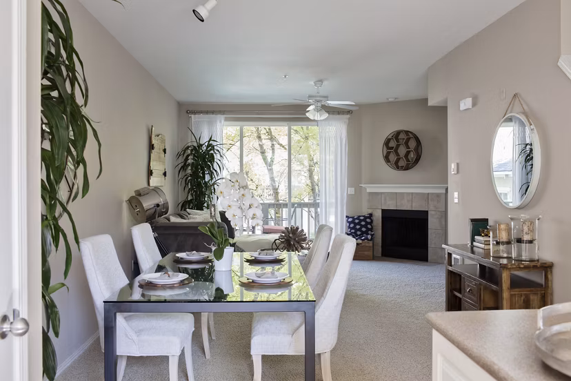 Dining room featuring sleek furniture and modern lighting at Lions Gate South Apartments