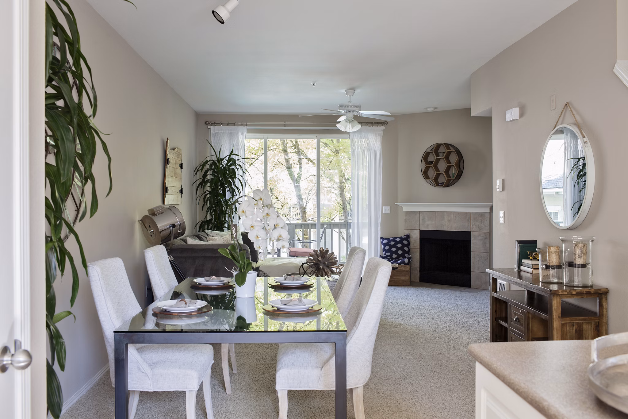 Dining room featuring sleek furniture and modern lighting at Lions Gate South Apartments