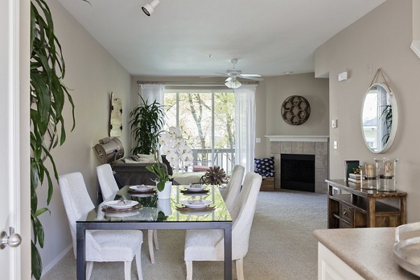 Dining room featuring sleek furniture and modern lighting at Lions Gate South Apartments