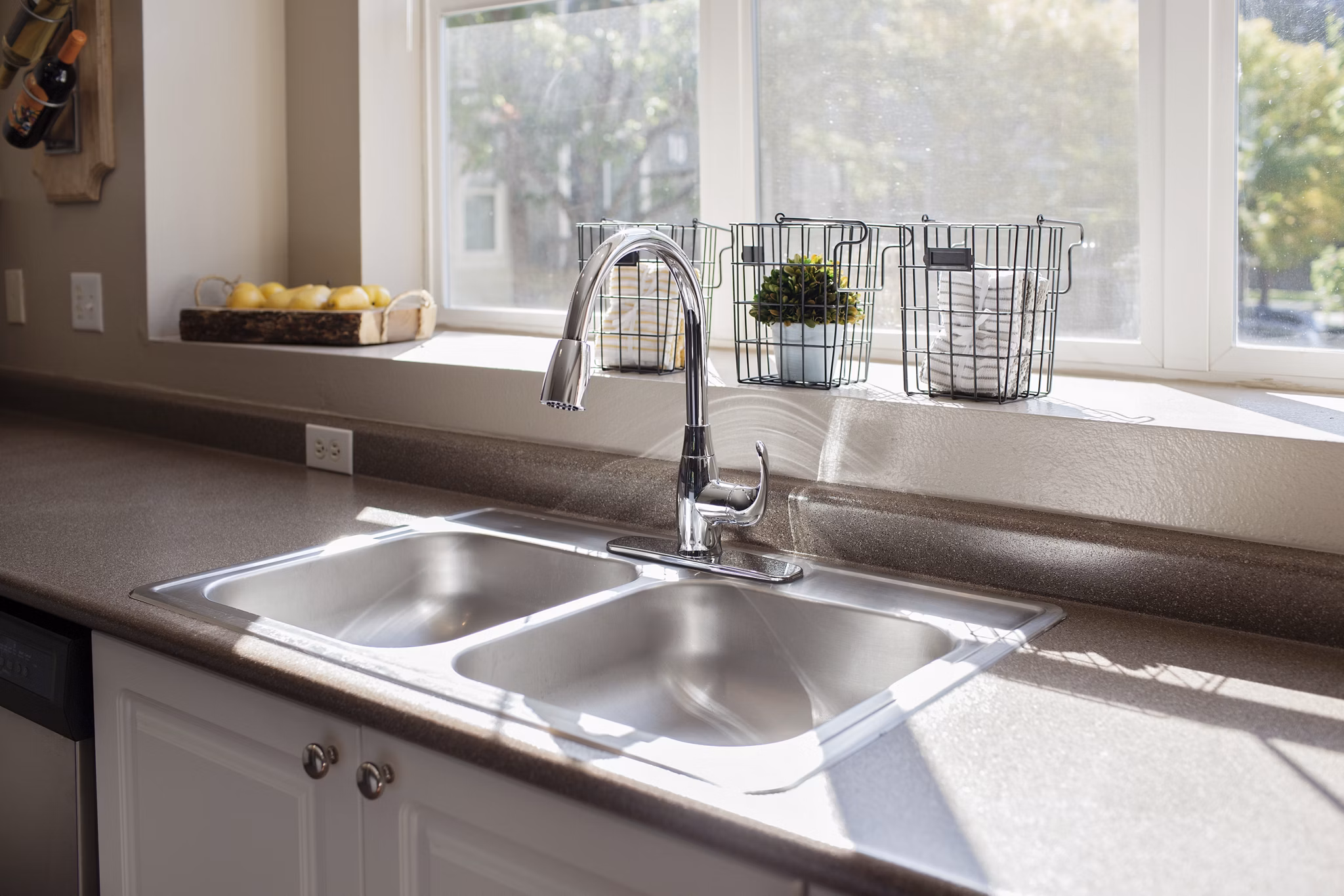 Modern kitchen with stainless steel appliances at Lions Gate South Apartments
