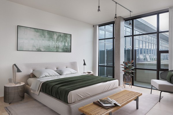 Spacious bedroom with modern decor at The Wyatt Apartments, a luxury Greystar property