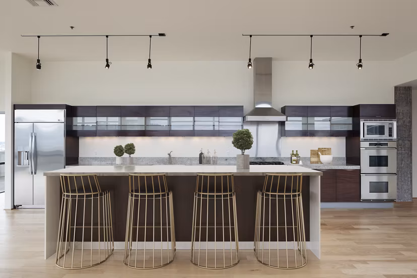 Sophisticated clubhouse featuring modern decor and ample seating at The Wyatt Apartments luxury residences