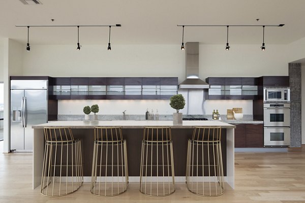 Sophisticated clubhouse featuring modern decor and ample seating at The Wyatt Apartments luxury residences
