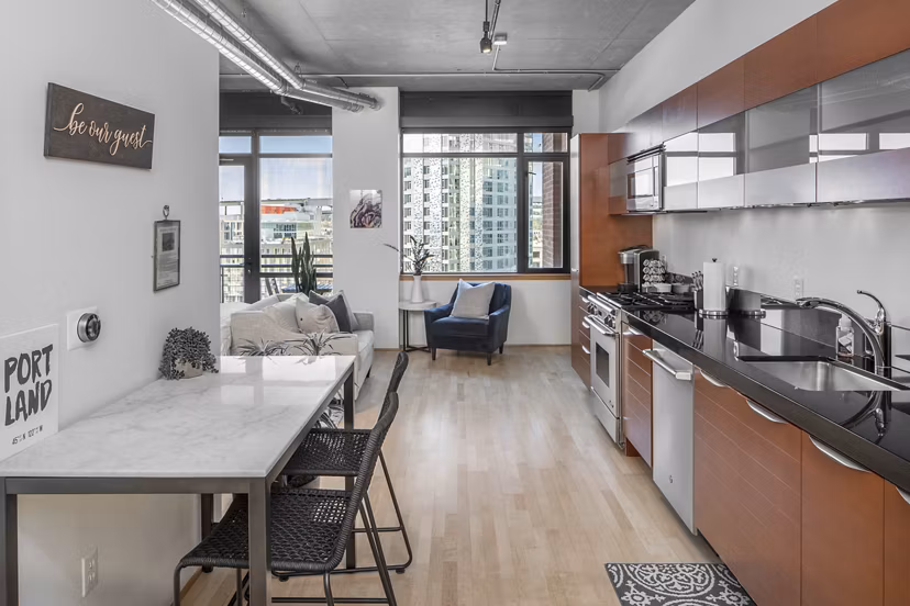 Modern kitchen with stainless steel appliances and island at The Wyatt Apartments