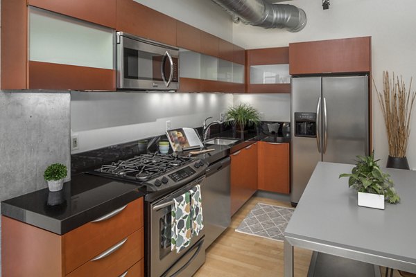 Modern kitchen with stainless steel appliances at The Wyatt Apartments in Greenville