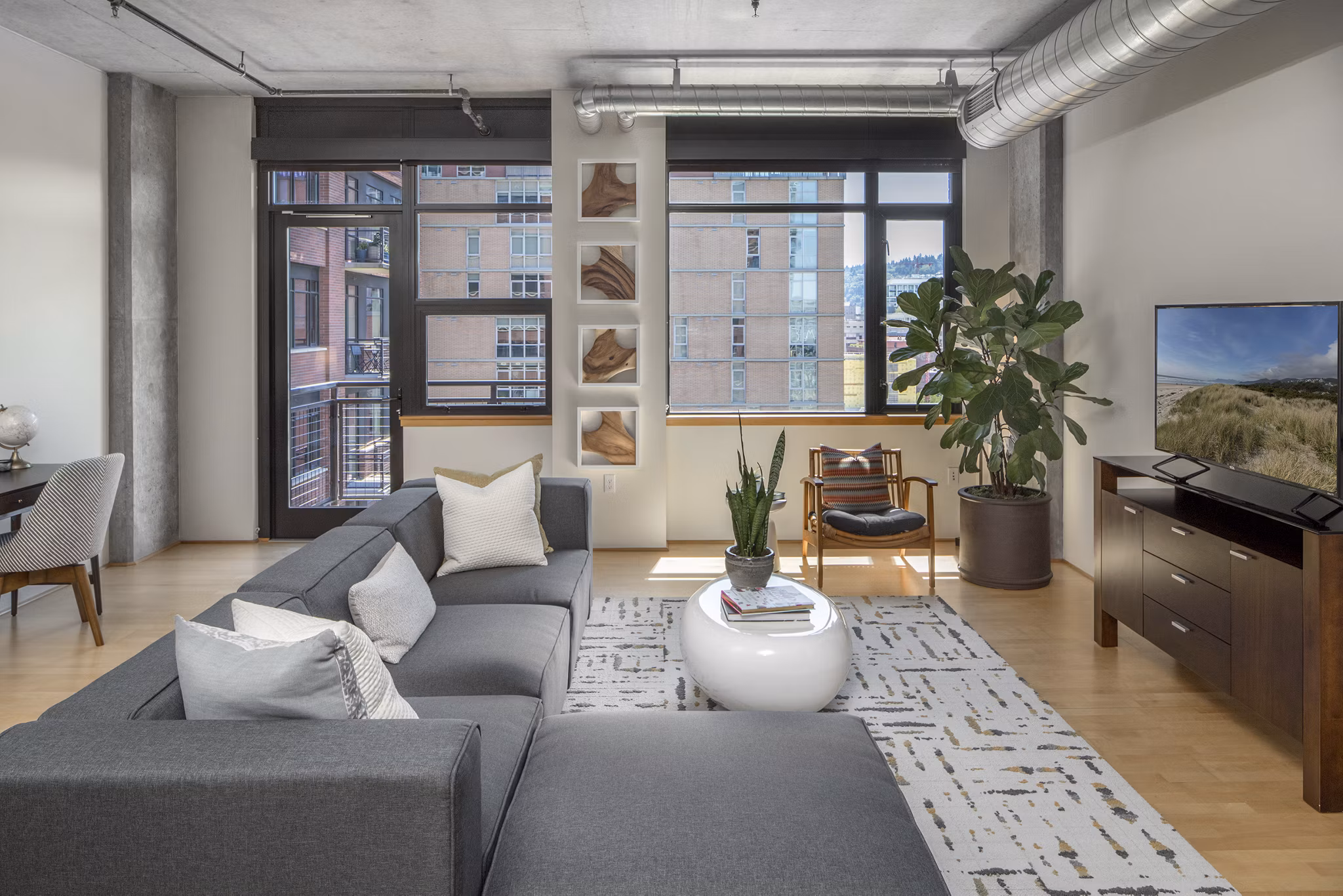 Spacious living room with modern decor in The Wyatt Apartments, ideal for luxury living