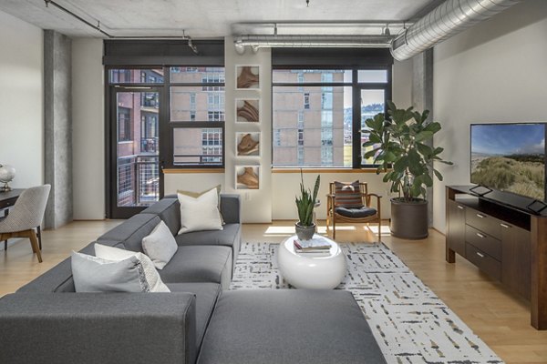 Spacious living room with modern decor in The Wyatt Apartments, ideal for luxury living