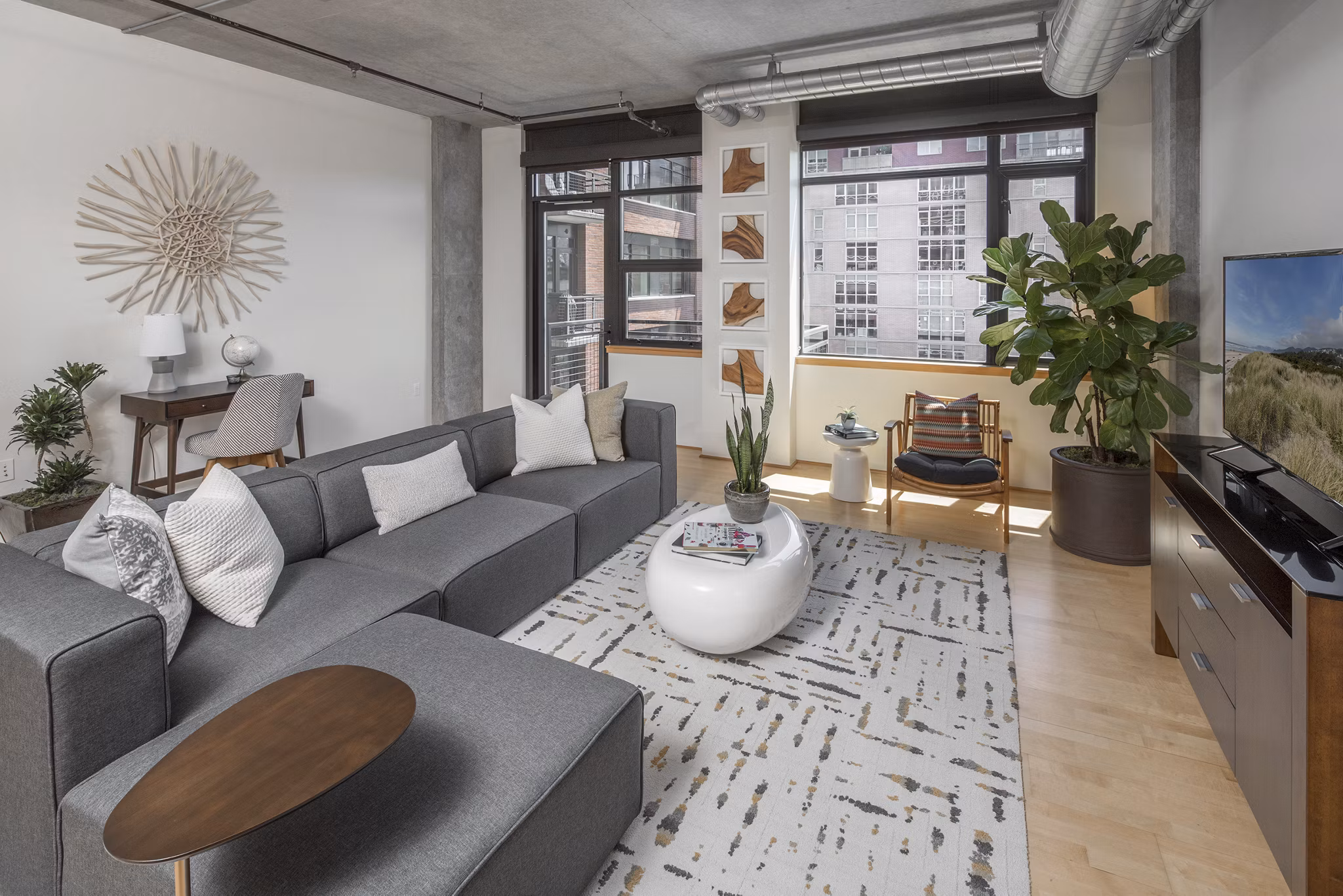 Modern living room with stylish decor and ample natural light at The Wyatt Apartments Ideal for luxury living in a prime location