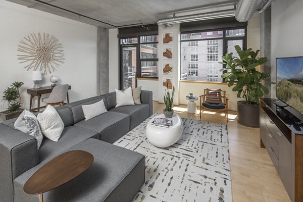 Modern living room with stylish decor and ample natural light at The Wyatt Apartments Ideal for luxury living in a prime location
