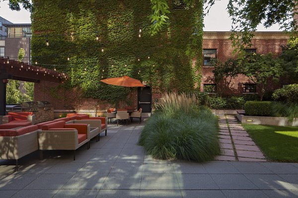 Tranquil courtyard with lush landscaping at The Wyatt Apartments, offering a serene outdoor retreat in a luxury living environment