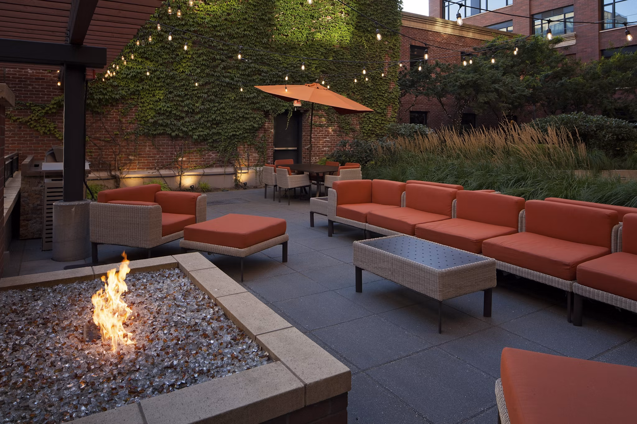 Cozy outdoor fire pit area at The Wyatt Apartments, perfect for luxury living with relaxation spots under the stars