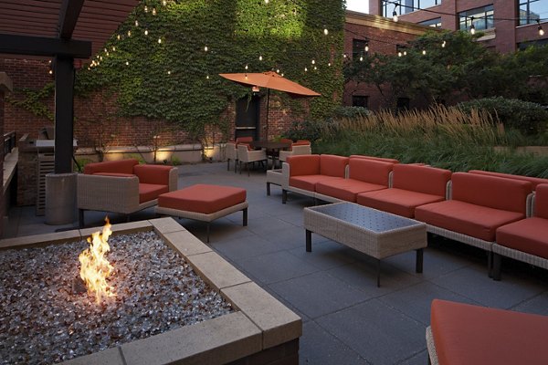 Cozy outdoor fire pit area at The Wyatt Apartments, perfect for luxury living with relaxation spots under the stars