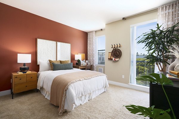 Cozy bedroom with modern furnishings at Bridgepointe Apartments