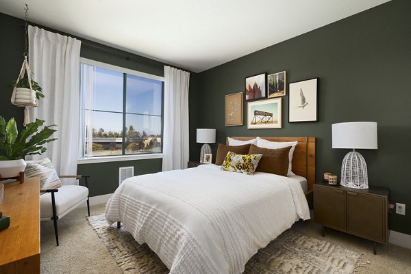 Cozy bedroom with modern furnishings at Bridgepointe Apartments