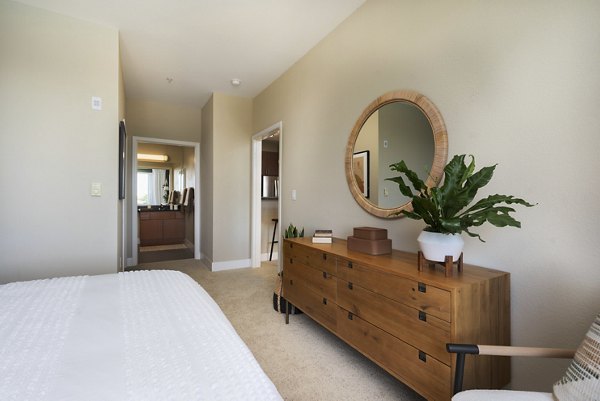 Cozy bedroom with modern furnishings at Bridgepointe Apartments