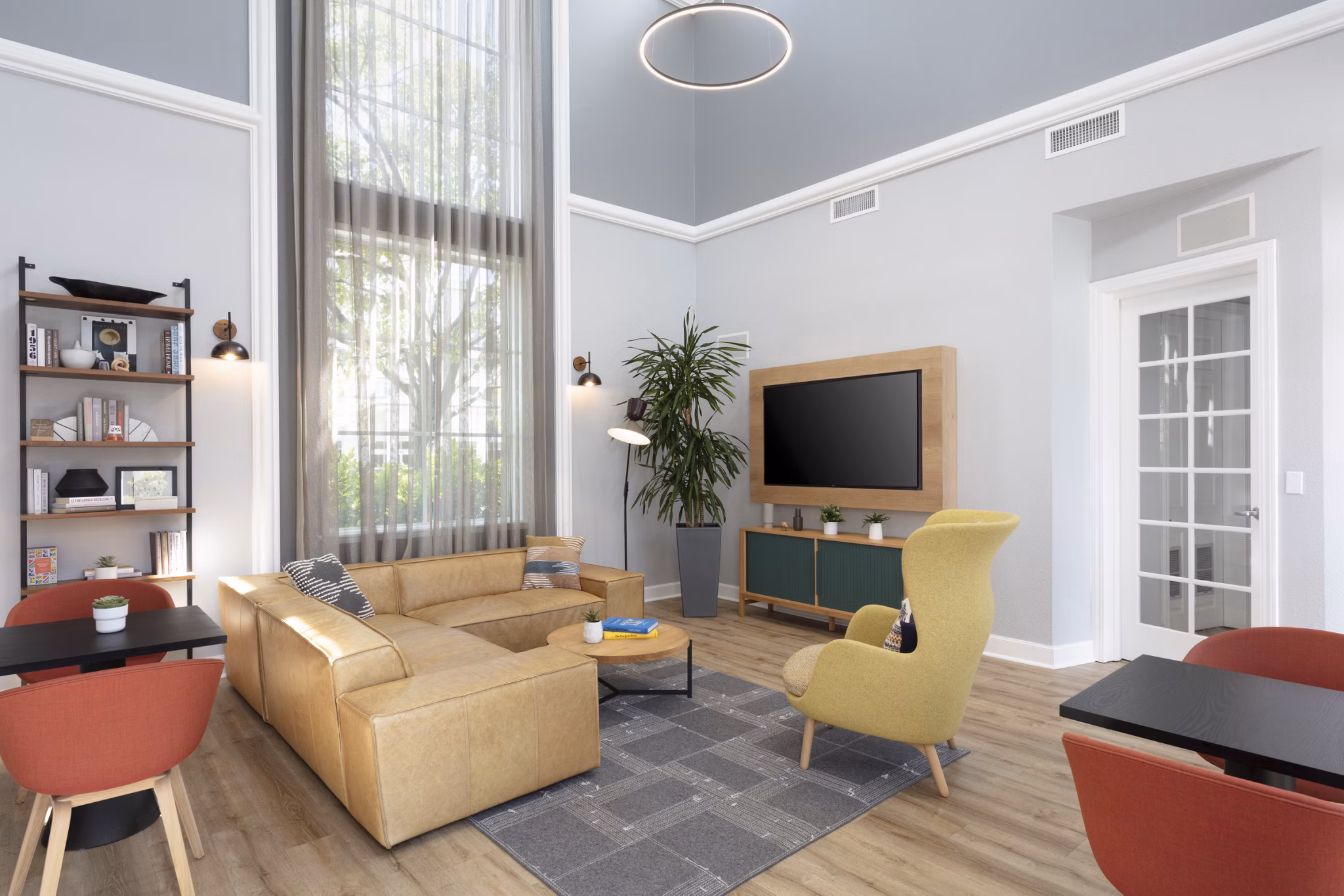 Bridgepointe Apartments: Modern clubhouse featuring cozy seating and entertainment areas