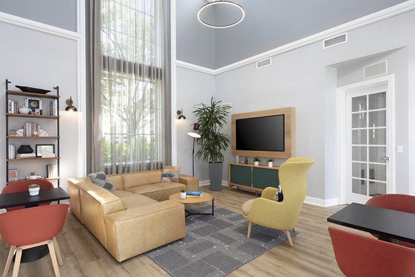 Bridgepointe Apartments: Modern clubhouse featuring cozy seating and entertainment areas