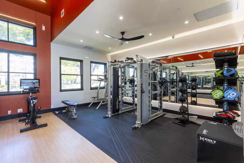 Fitness center equipped with modern exercise machines at Bridgepointe Apartments