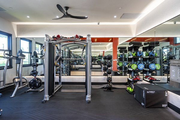 Fitness center equipped with modern exercise machines at Bridgepointe Apartments