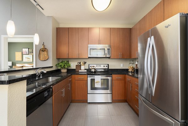 Modern kitchen with stainless steel appliances at Bridgepointe Apartments