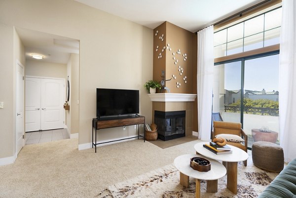 Elegant living room with contemporary furnishings at Bridgepointe Apartments, a Greystar luxury property
