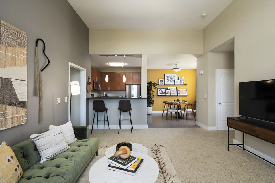 Elegant living room with contemporary furnishings at Bridgepointe Apartments, a Greystar luxury property